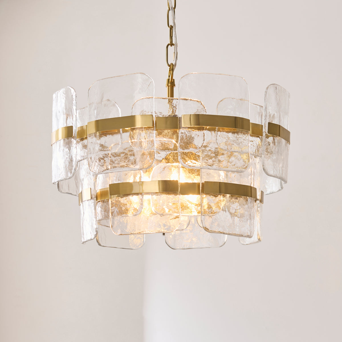 Side profile revealing the pendant's elegant proportions and layered silhouette