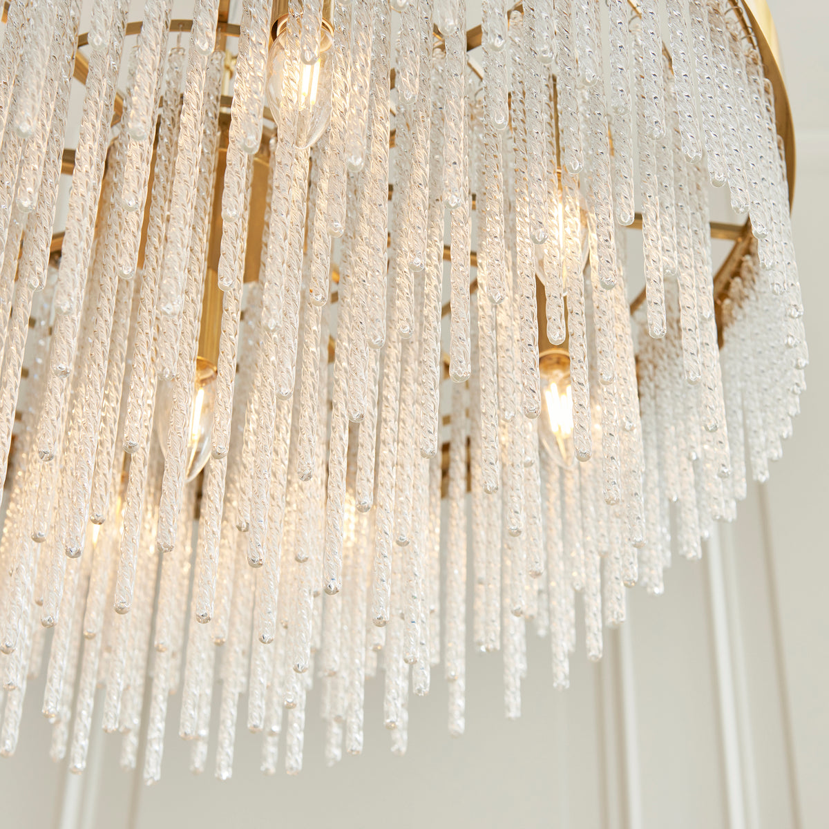 Close-up revealing the textured twisted glass rods and shimmering decorative detailing