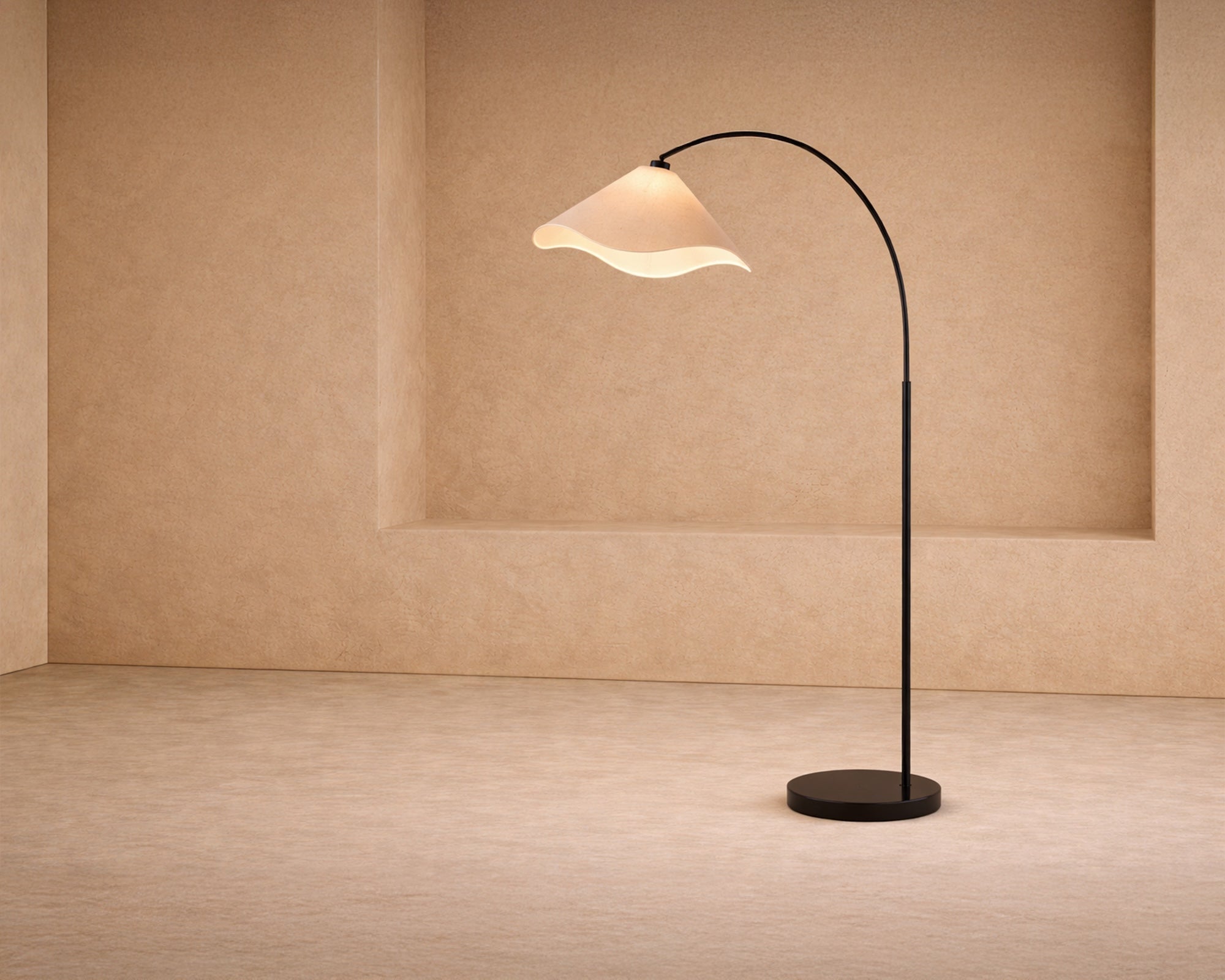 Blossom Floor Lamp by Liang & Eimil featuring an arched matte black frame and beige linen shade