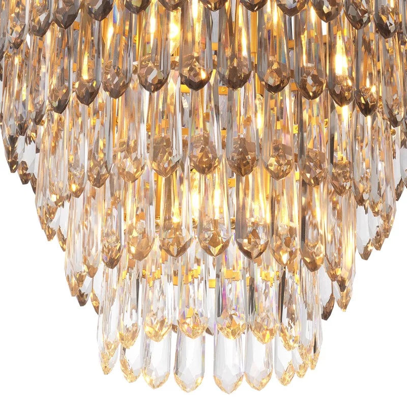 Gwendolyn Chandelier featuring a refined antique brass frame and sculptural glass detailing