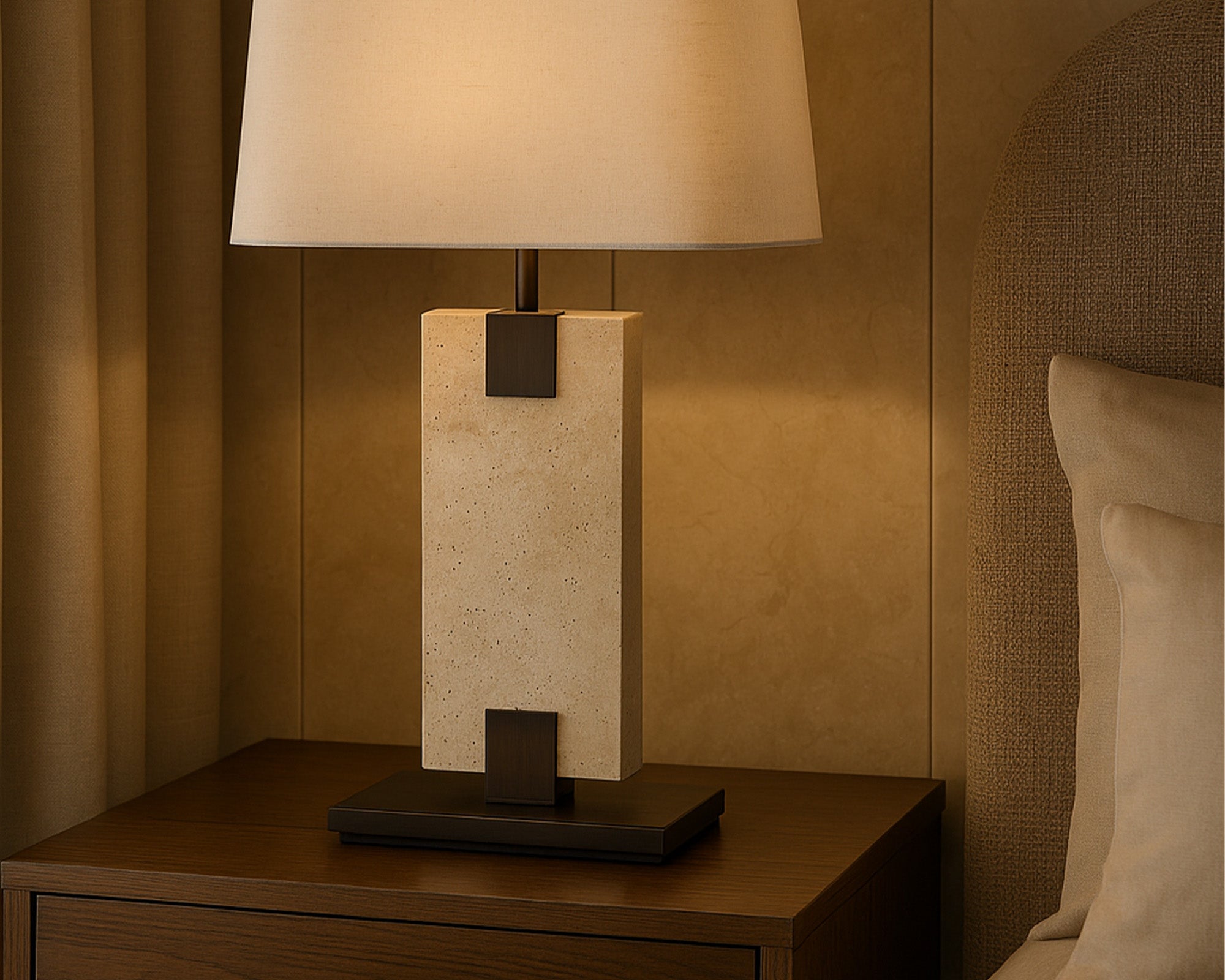 Madison Table Lamp by Liang & Eimil featuring an open pore travertine base and off-white linen shade