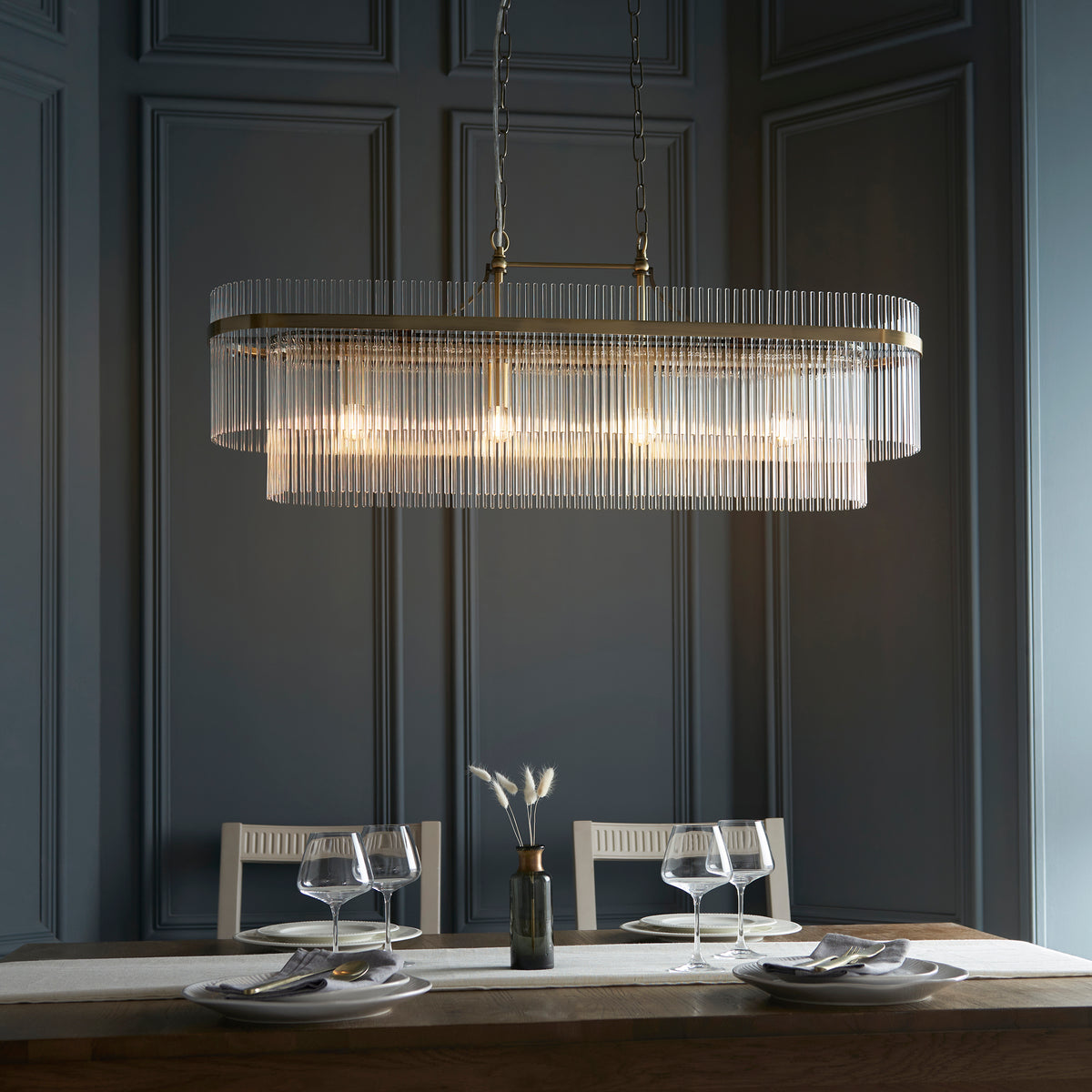 Marietta 4Lt Linear Pendant creating a sophisticated focal point above an elegant dining table