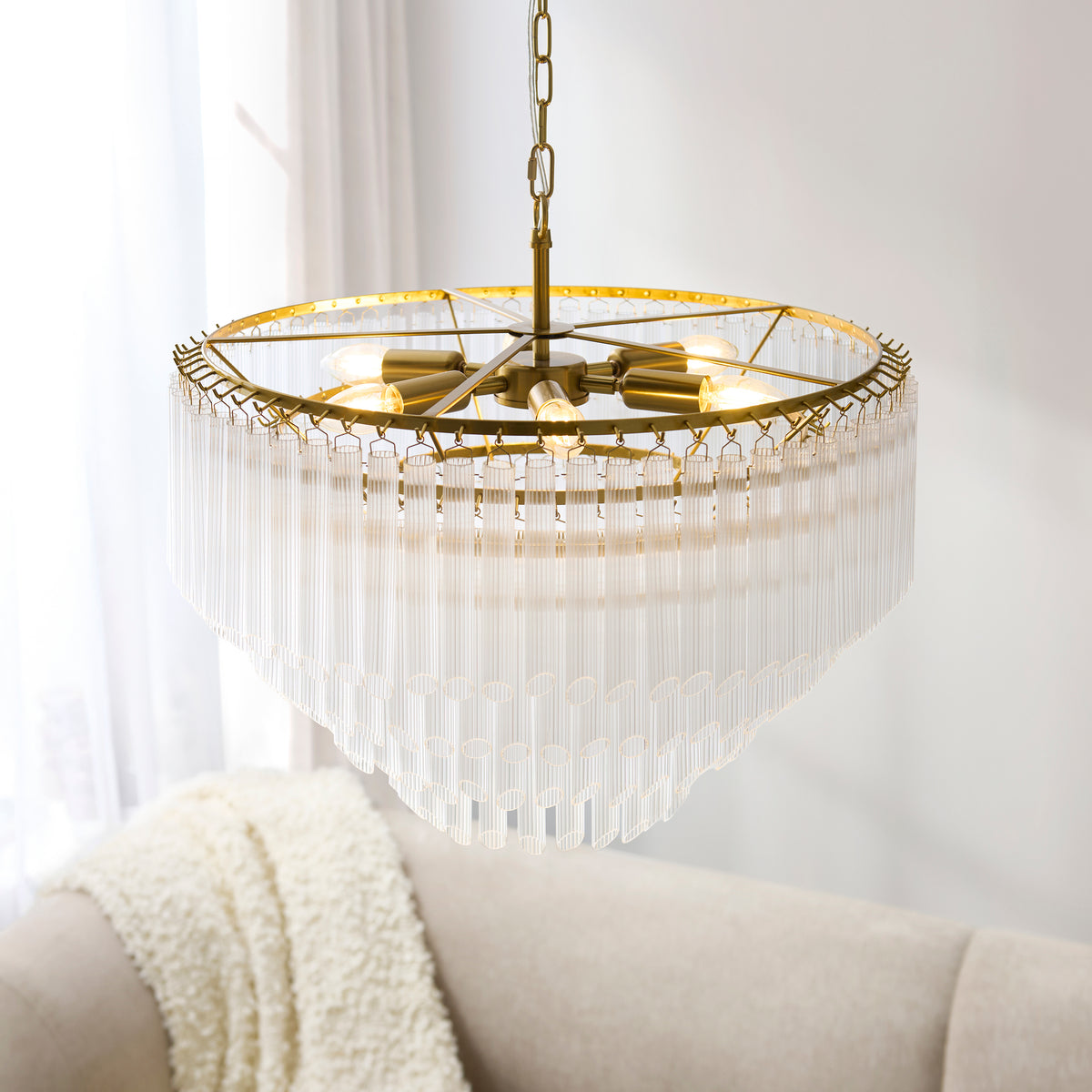 Montpellier 6Lt Pendant enhancing a grand entrance hall with sculptural brass and glass detailing