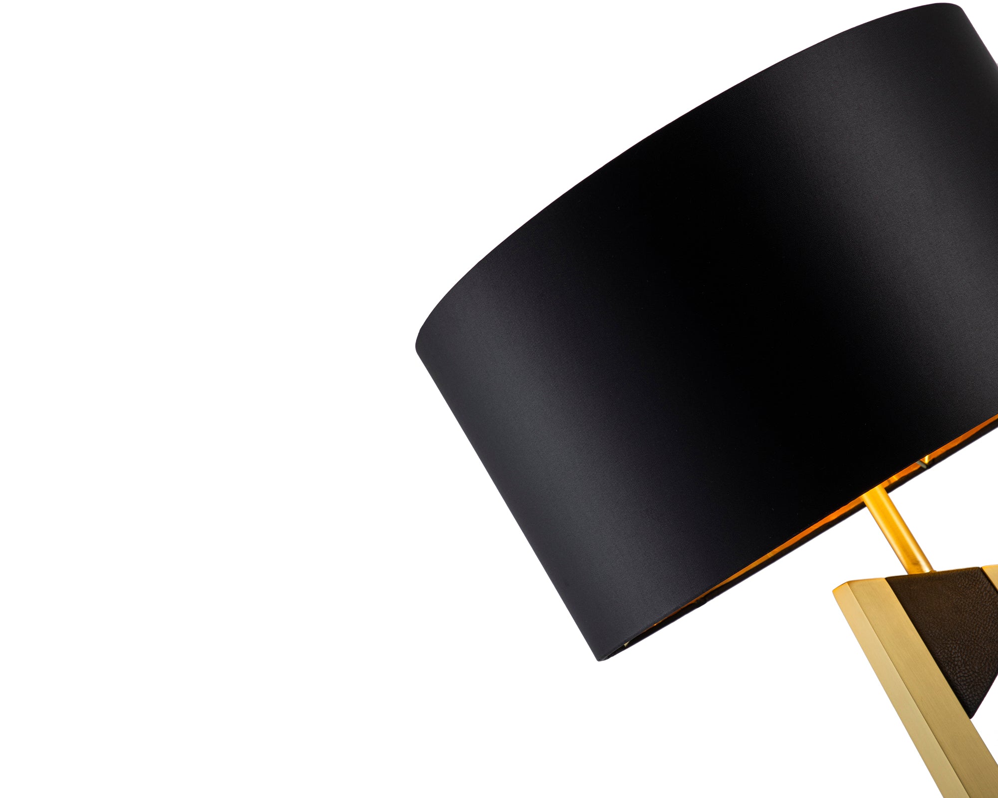 Pharo Table Lamp by Liang & Eimil featuring a brushed brass frame, black leather accents, and a black fabric shade with gold interior