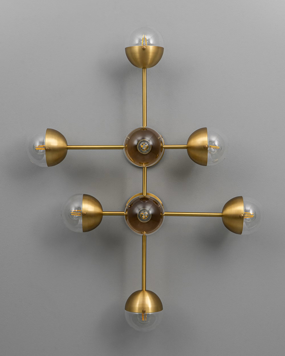 Sculptural metal and glass detailing of the Molecule 8 wall light