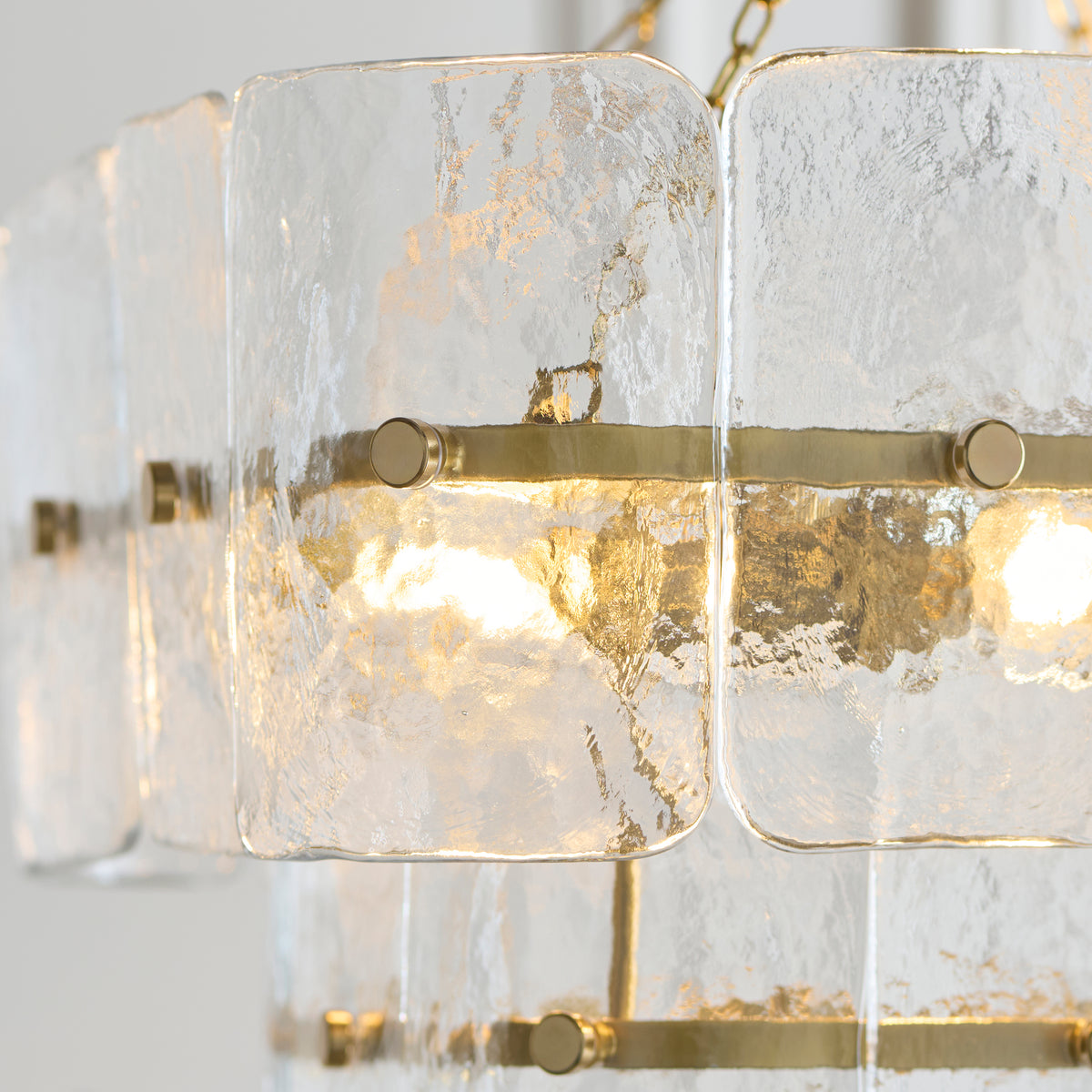 Handmade clear textured glass panels displaying intricate surface detailing