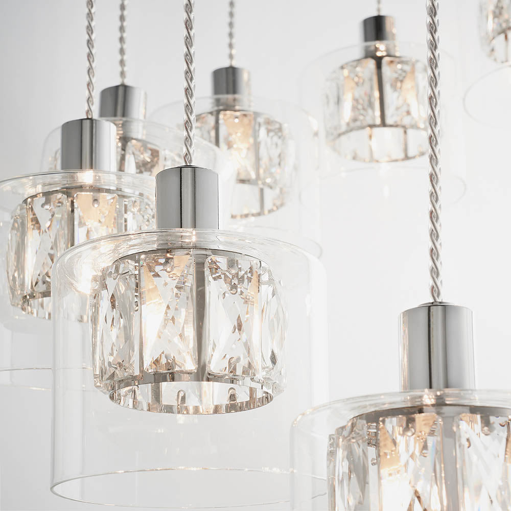 Premium close-up highlighting the interplay of chrome, glass and faceted crystal