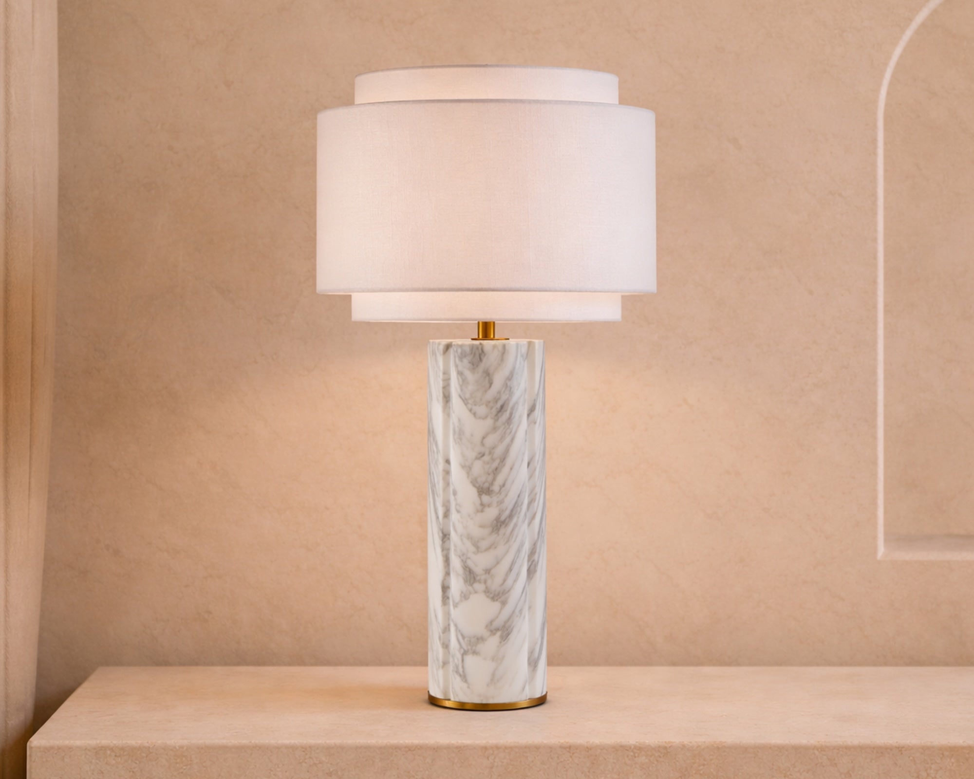Aulis Table Lamp by Liang & Eimil featuring a cylindrical marble base with antique brass accents and a layered linen shade