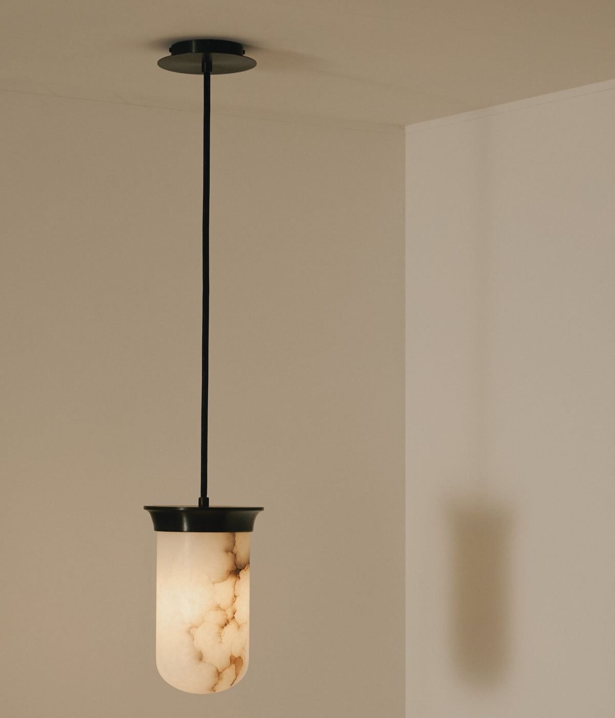 Detailed view of the Yukimi Pendant alabaster shade and mesh chain