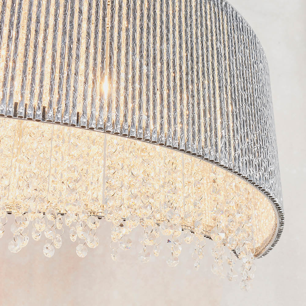 Galina 8Lt Linear Pendant illuminated to create striking patterns of reflected light