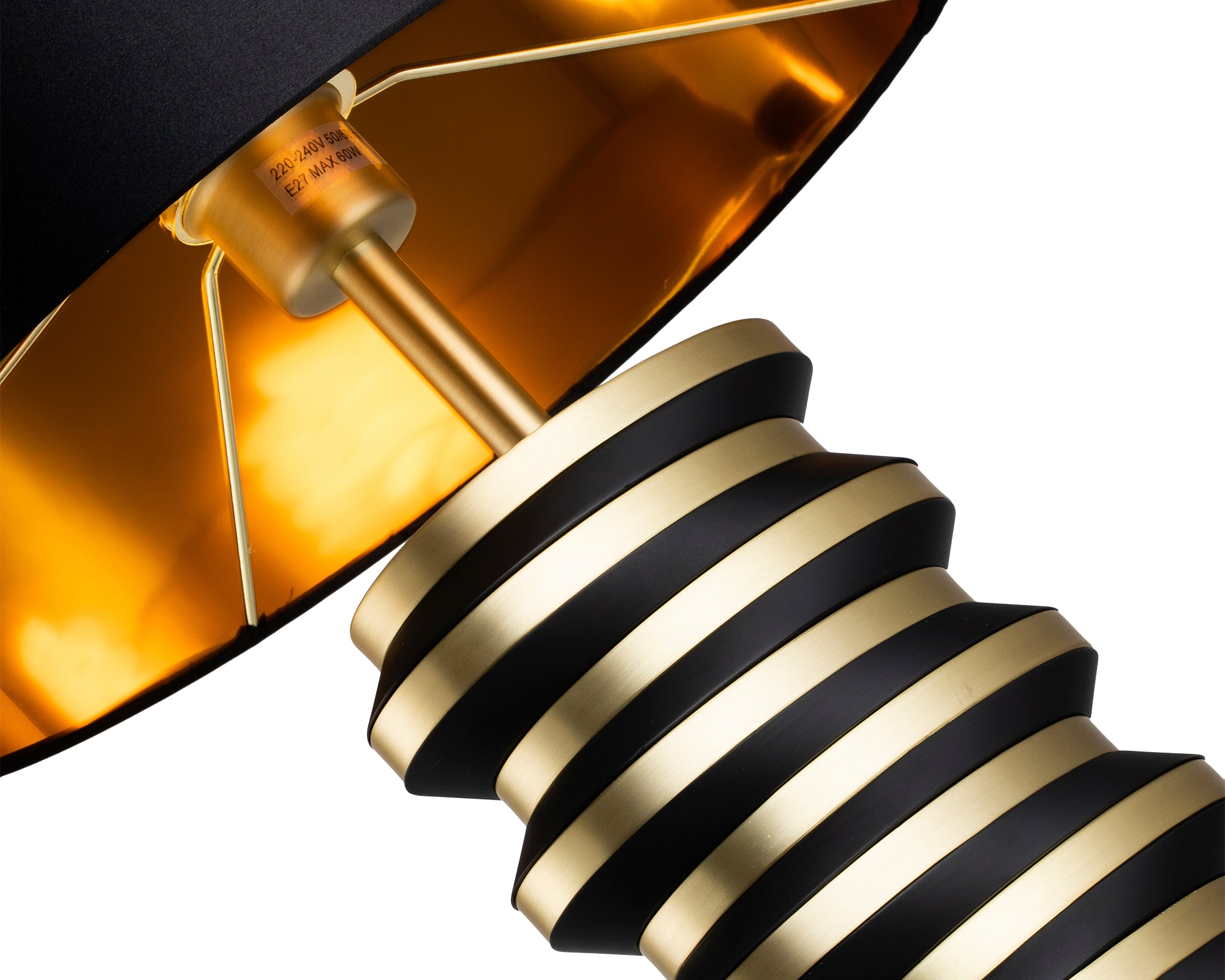 Jacquard Table Lamp by Liang & Eimil featuring a brushed brass stacked disc base with matte black accents and a black fabric shade