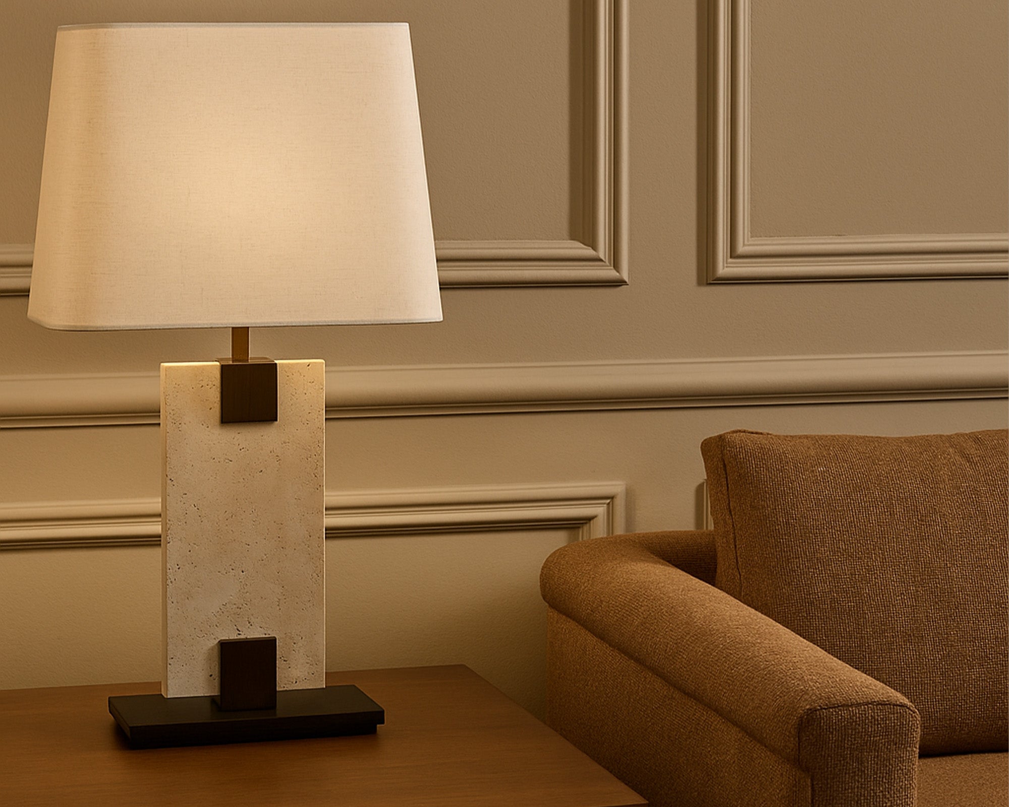 Madison Table Lamp by Liang & Eimil featuring an open pore travertine base and off-white linen shade