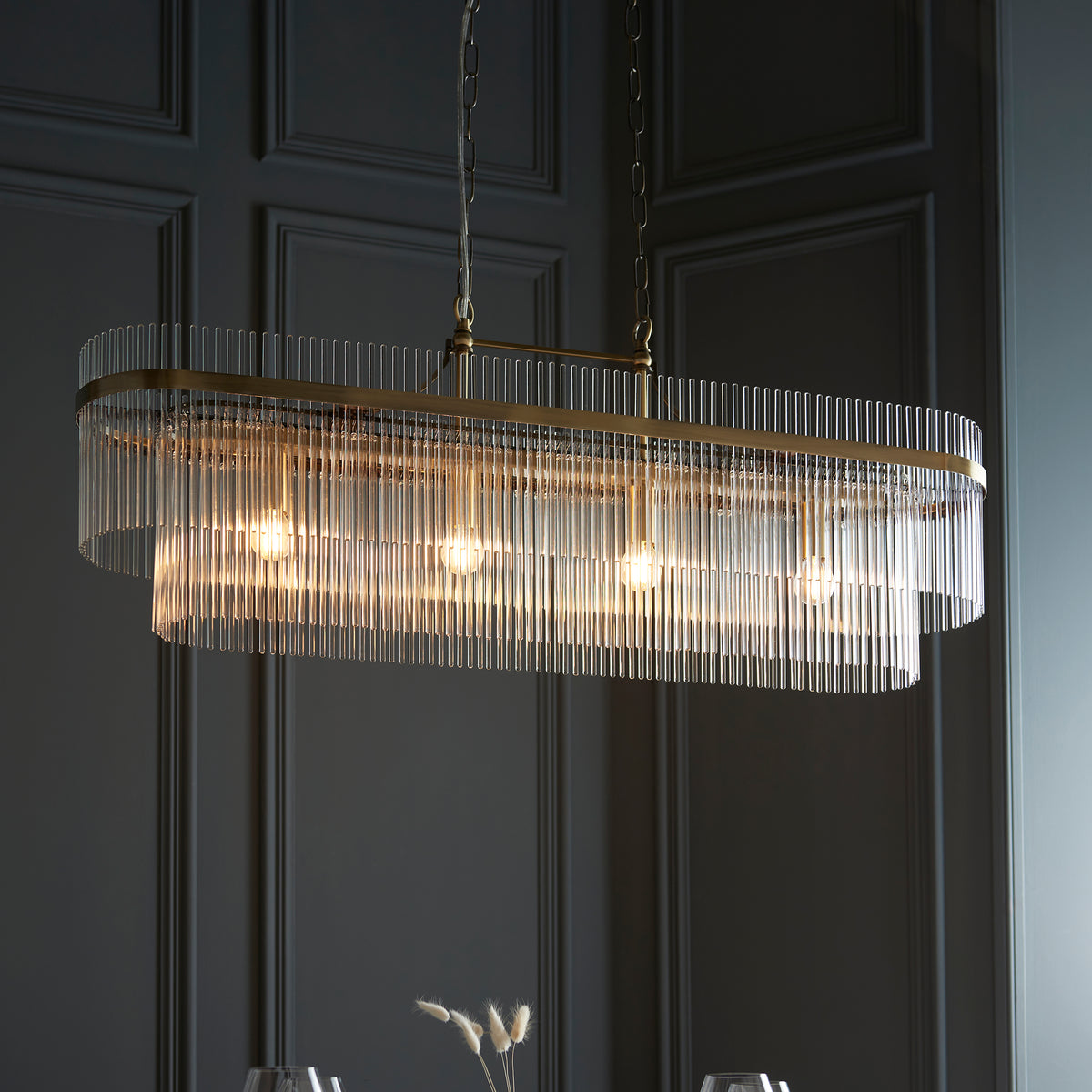 Premium close-up highlighting the combination of antique brass metalwork and decorative clear glass