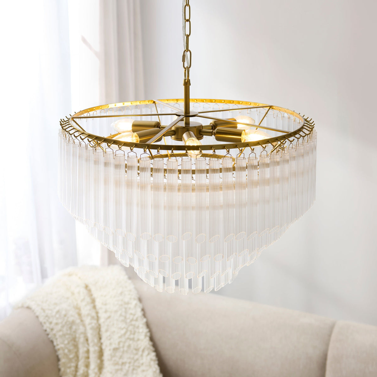 Montpellier 6Lt Pendant enhancing a grand entrance hall with sculptural brass and glass detailing