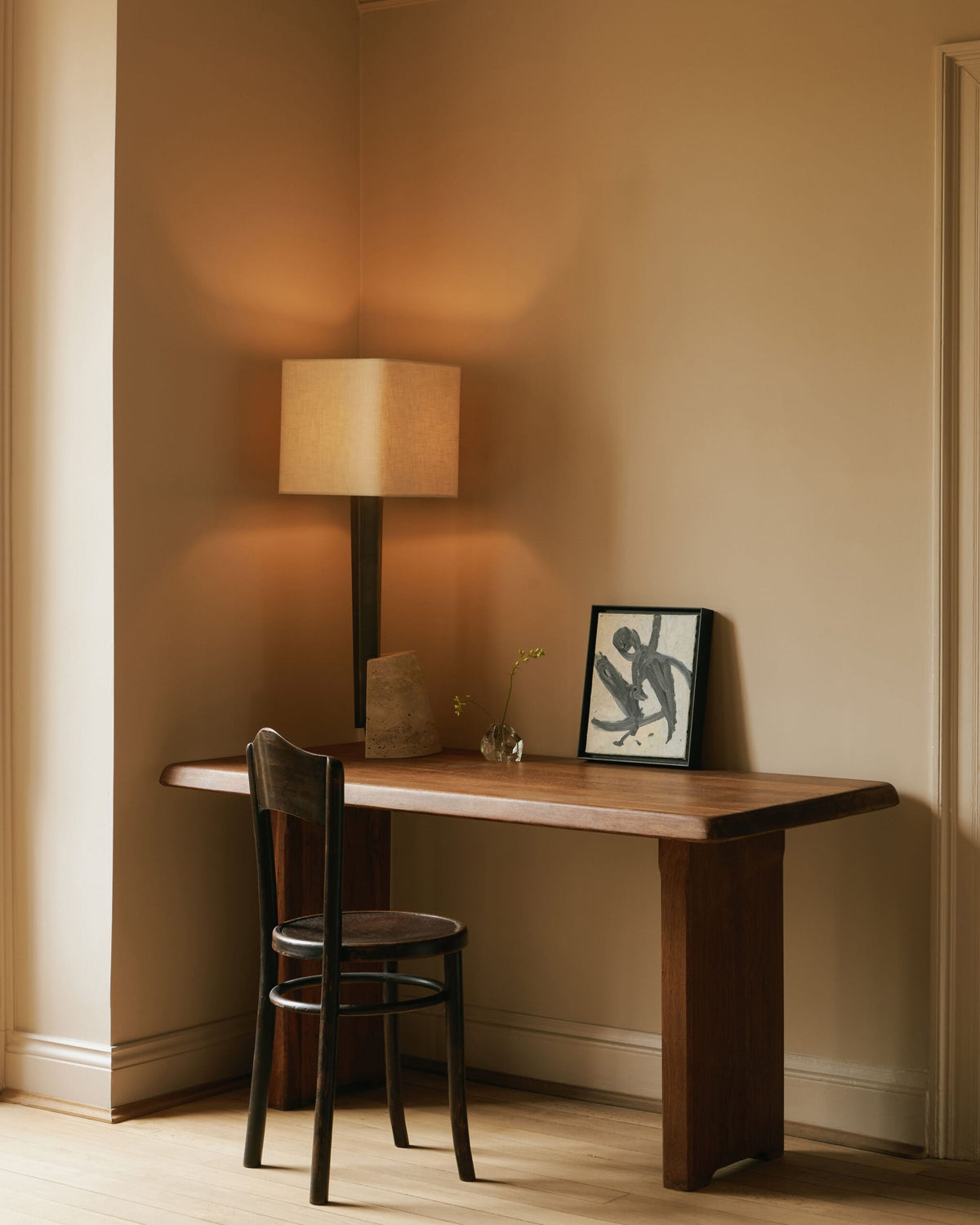 Roc Table featuring elegantly antiqued bronze metalwork with a distinctive multifaceted silhouette