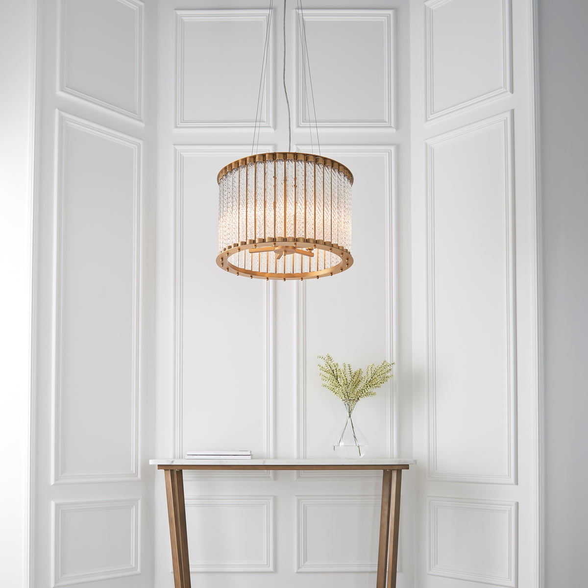 Romola 6 Light Pendant illuminated to reveal shimmering reflections through the glass