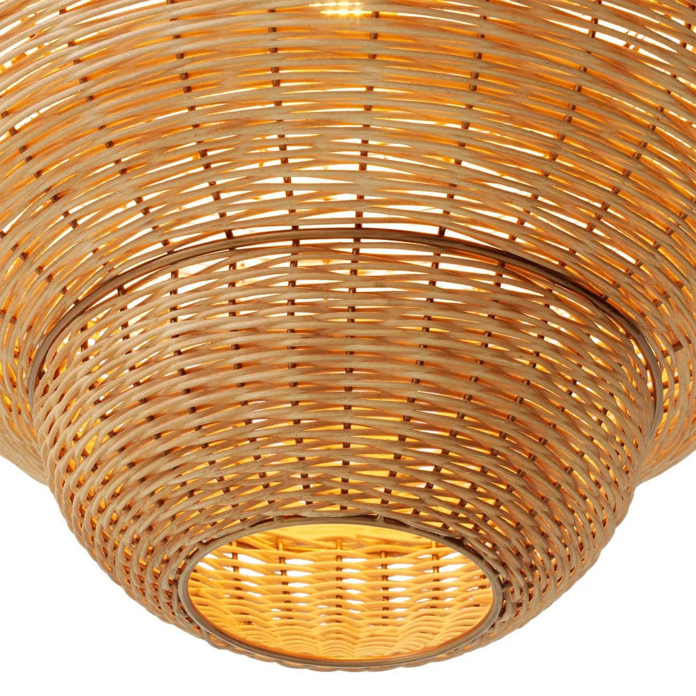 Rowlan Pendant illuminated to create a warm and inviting atmosphere through its woven rattan structure.