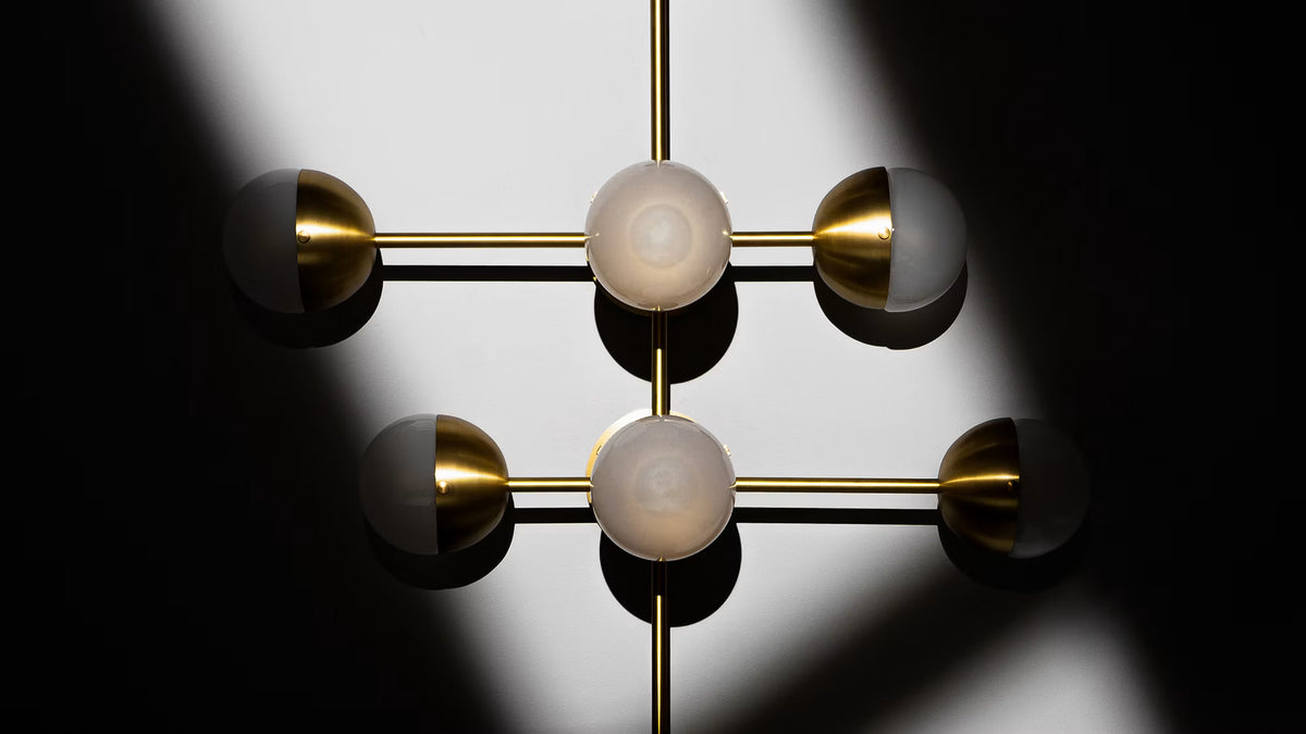 Borosilicate glass detailing of the Schwung Molecule 8 Wall Sconce