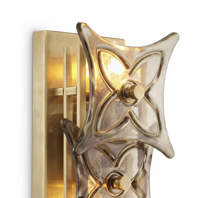 Side view of the Silvaris Wall Lamp revealing its sculptural floral glass arrangement and slender profile